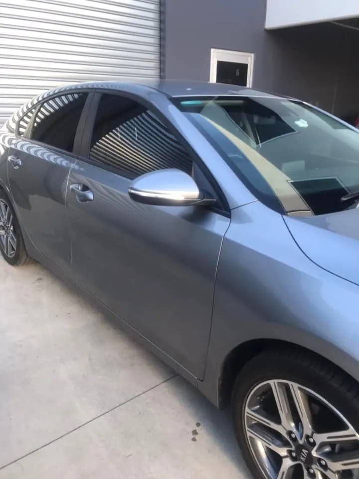 Car with professional window tint by KEN Express