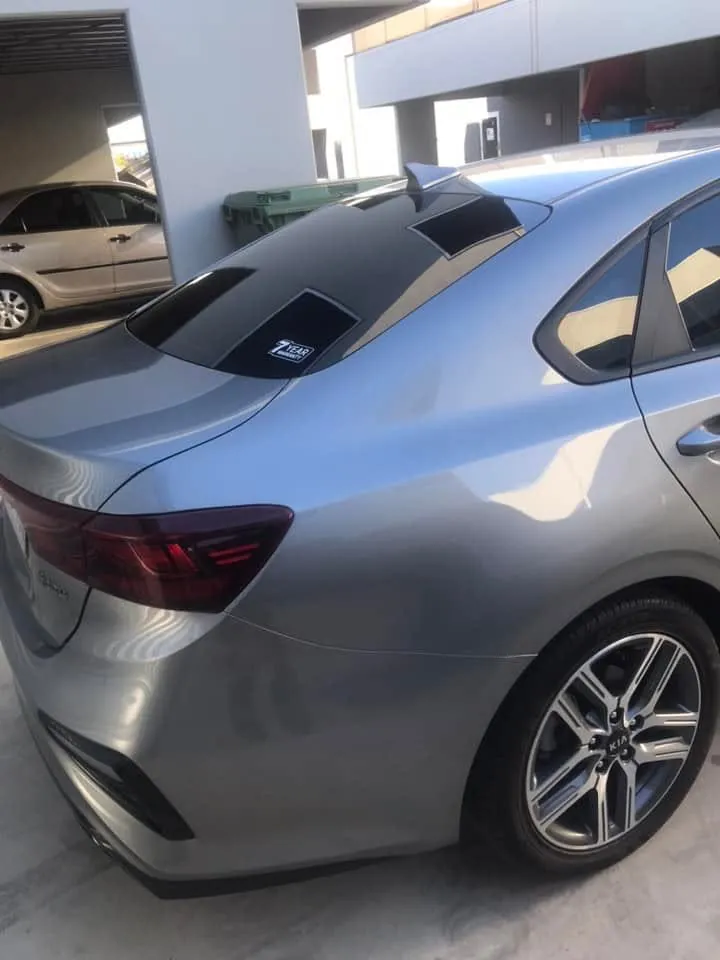 Car with professional window tint by KEN Express