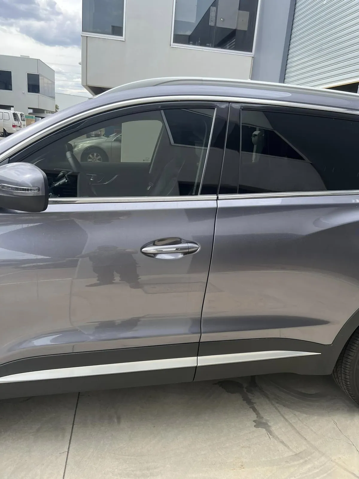 Blue Kia EV6 with tinted windows