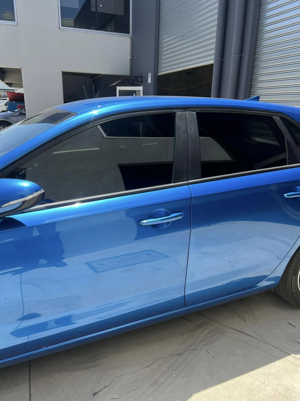 Car with professional window tint by KEN Express