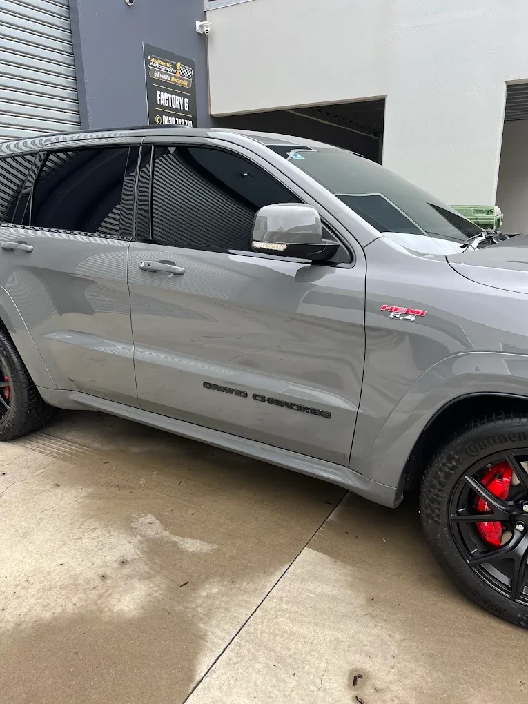 Car with professional window tint by KEN Express