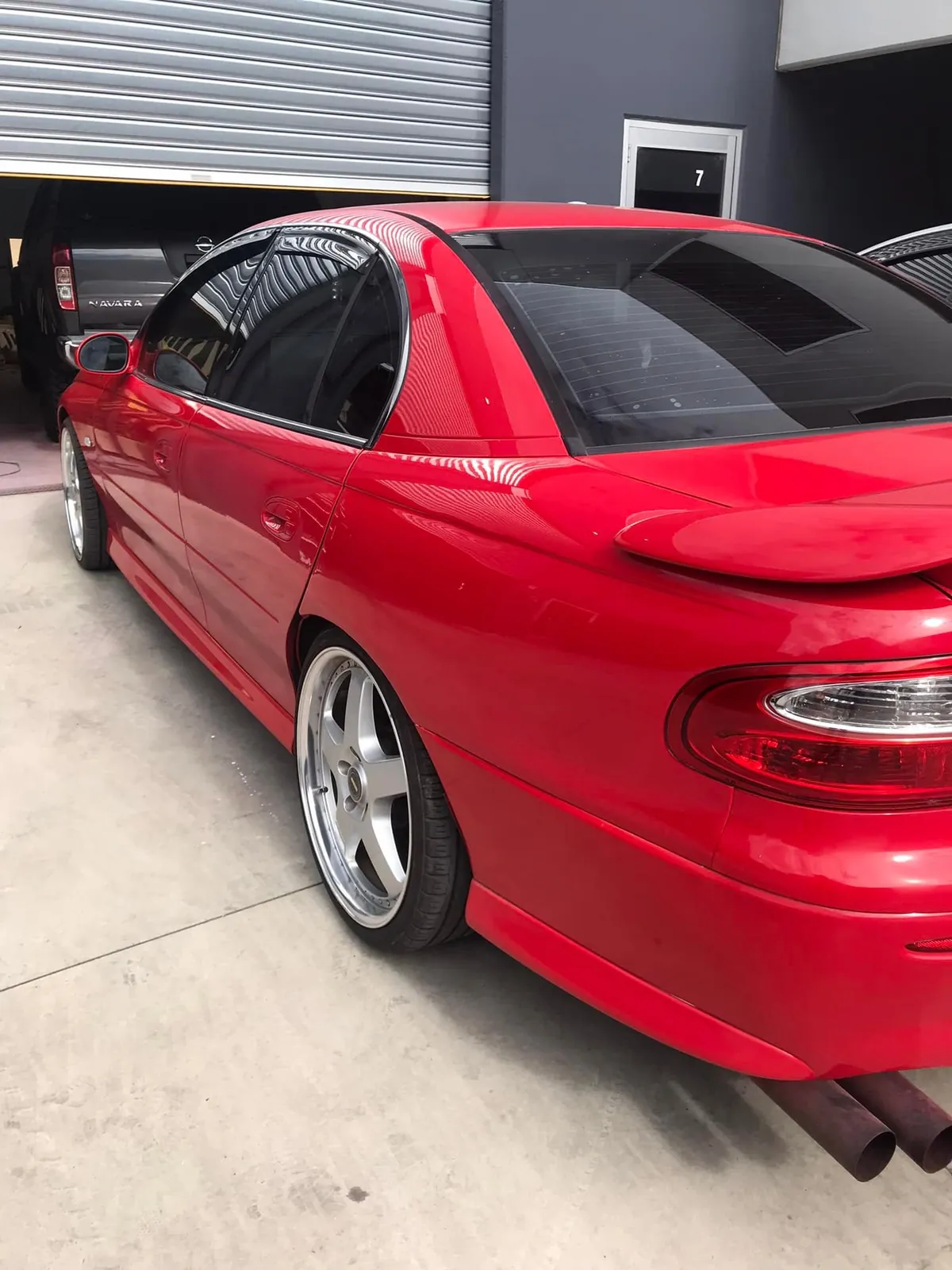 Restored red classic car by KEN Express