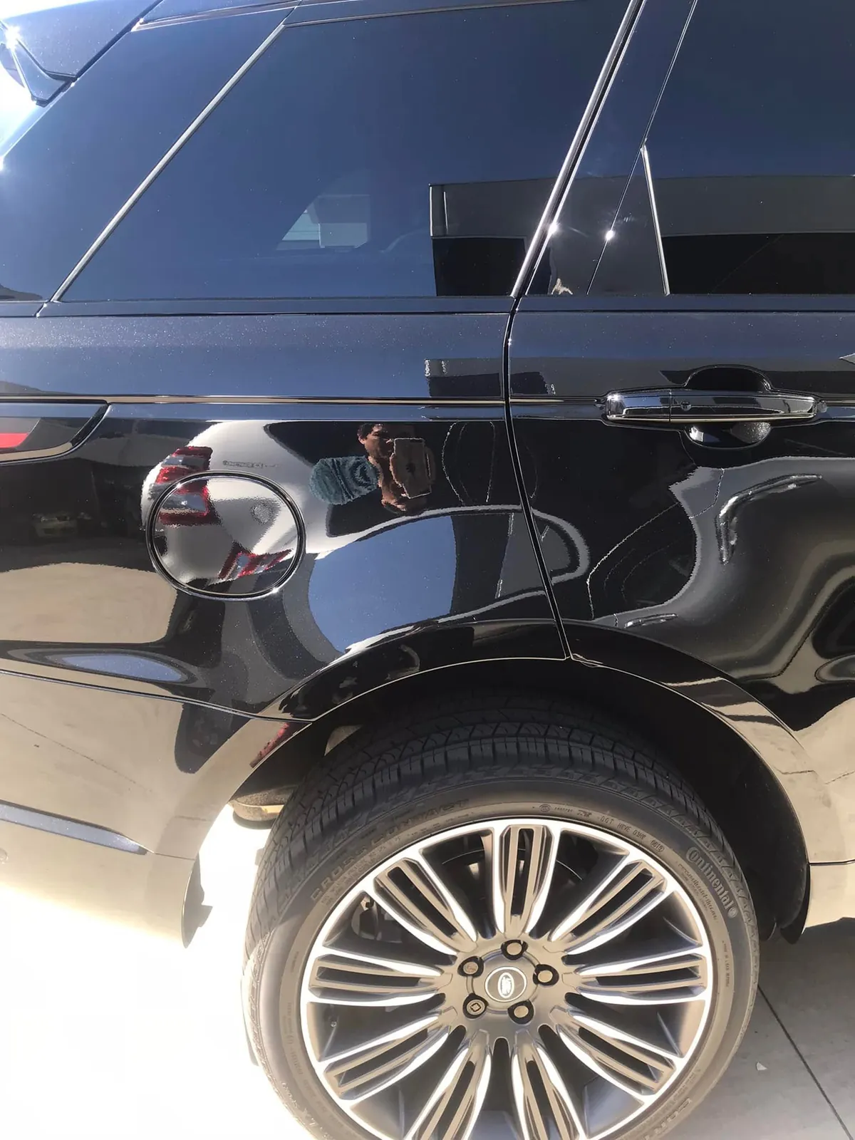 Black Range Rover with dark window tint